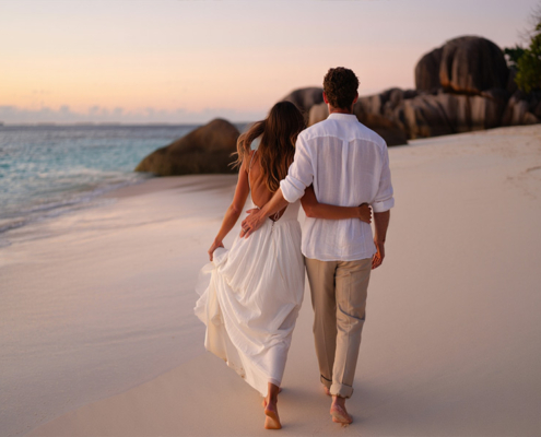 Best time to Travel to the Seychelles for a Wedding - couple at Anse Lazio beach