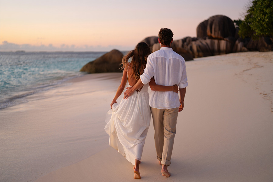 Best time to Travel to the Seychelles for a Wedding Best time to Travel to the Seychelles for a Wedding - couple at Anse Lazio beach